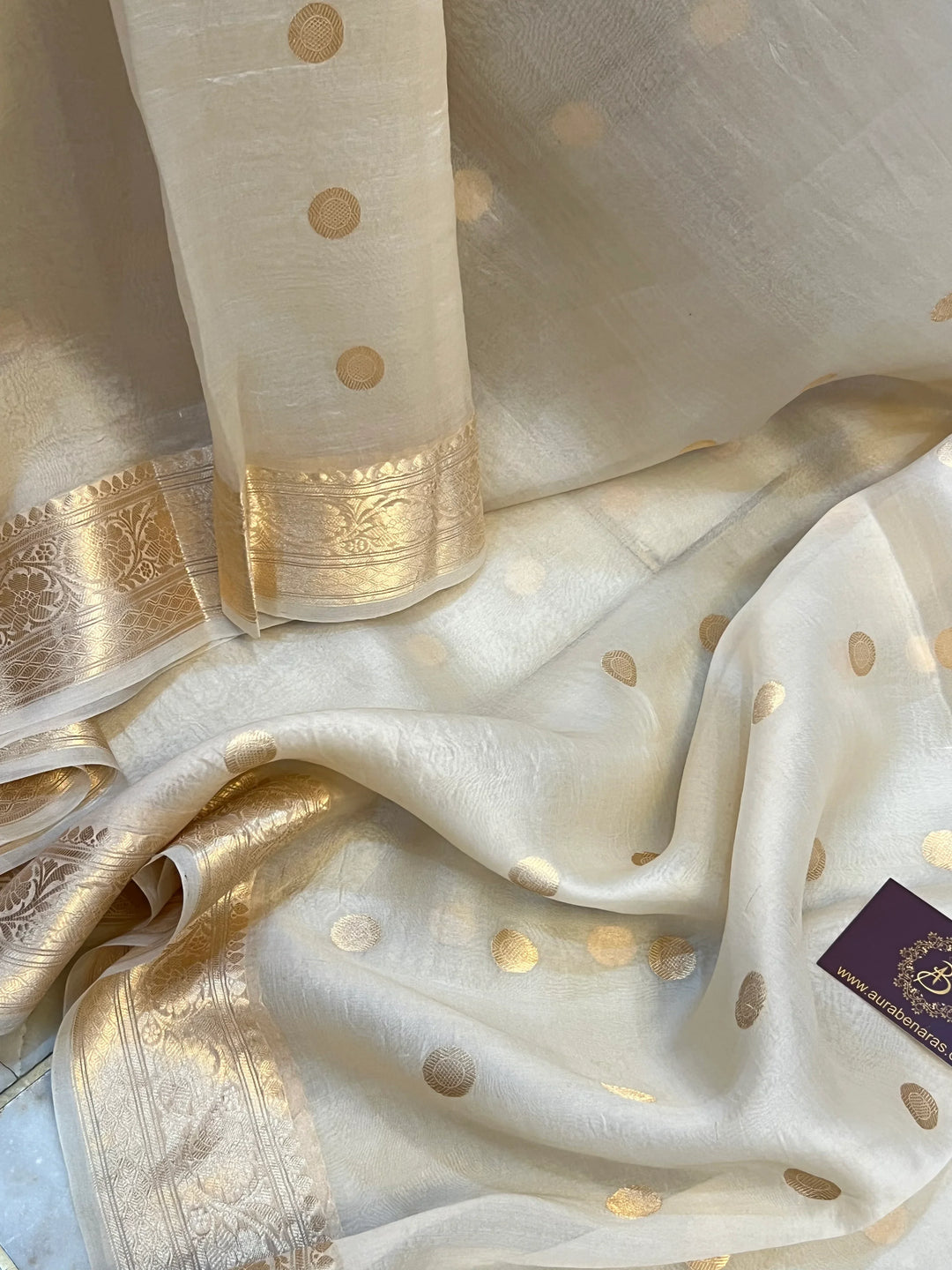 Cream Pure Banarasi handloom saree with intricate golden Kadhwa motifs 