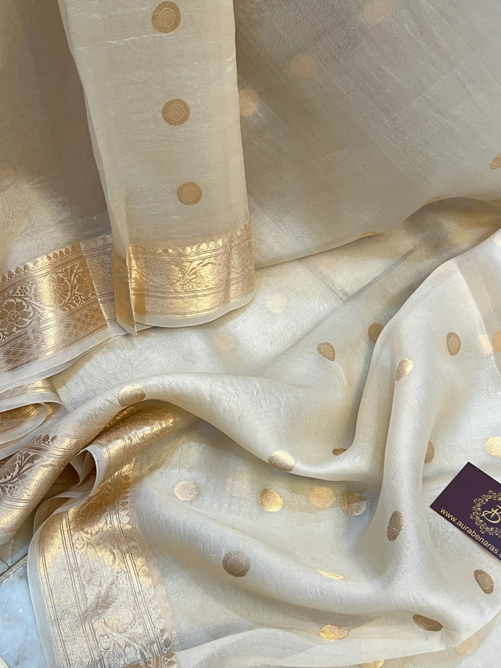 Cream Pure Banarasi handloom saree with intricate golden Kadhwa motifs 