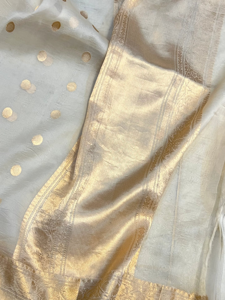 Cream Pure Banarasi handloom saree with intricate golden Kadhwa motifs 