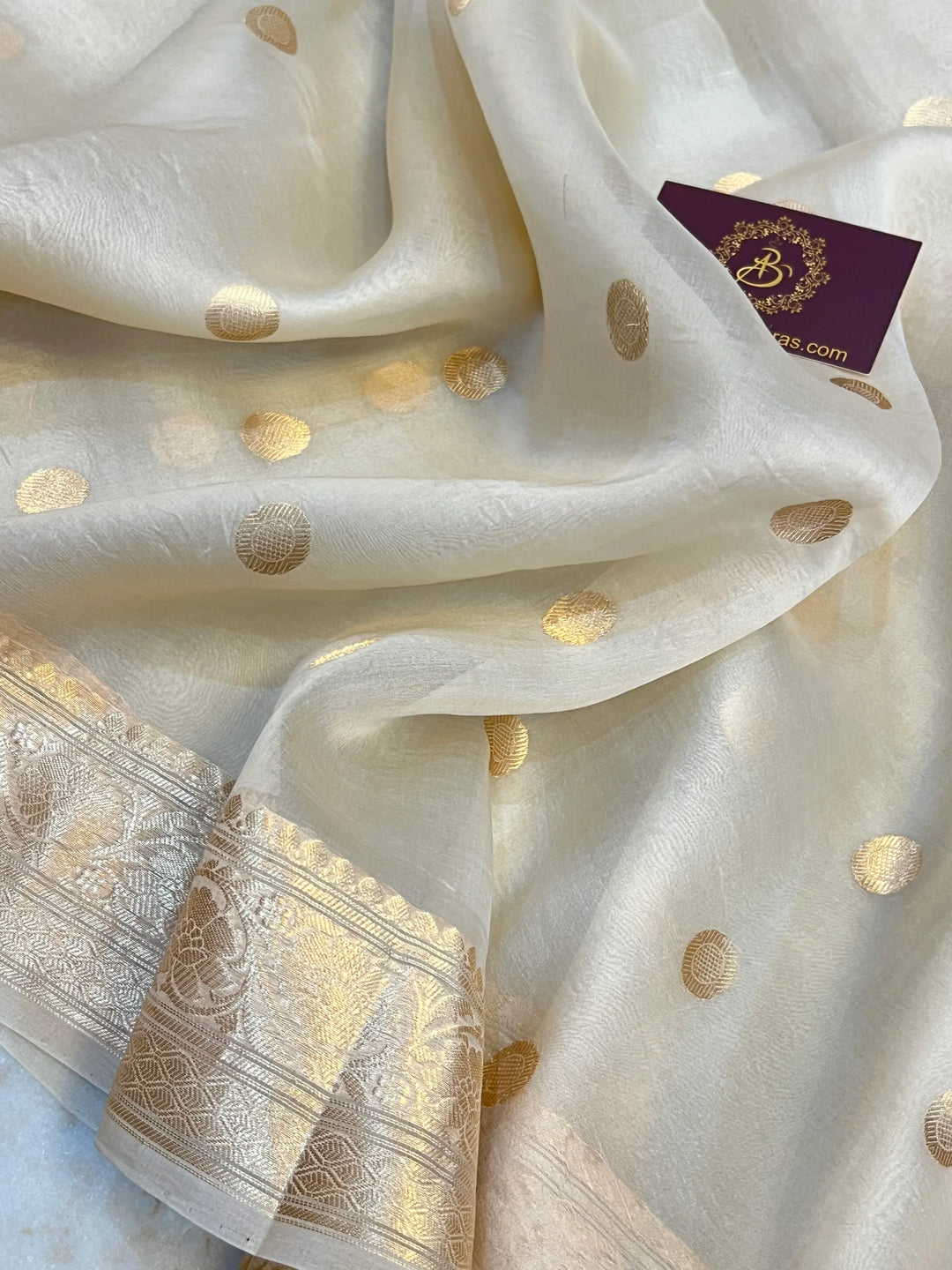 Cream Pure Banarasi handloom saree with intricate golden Kadhwa motifs 