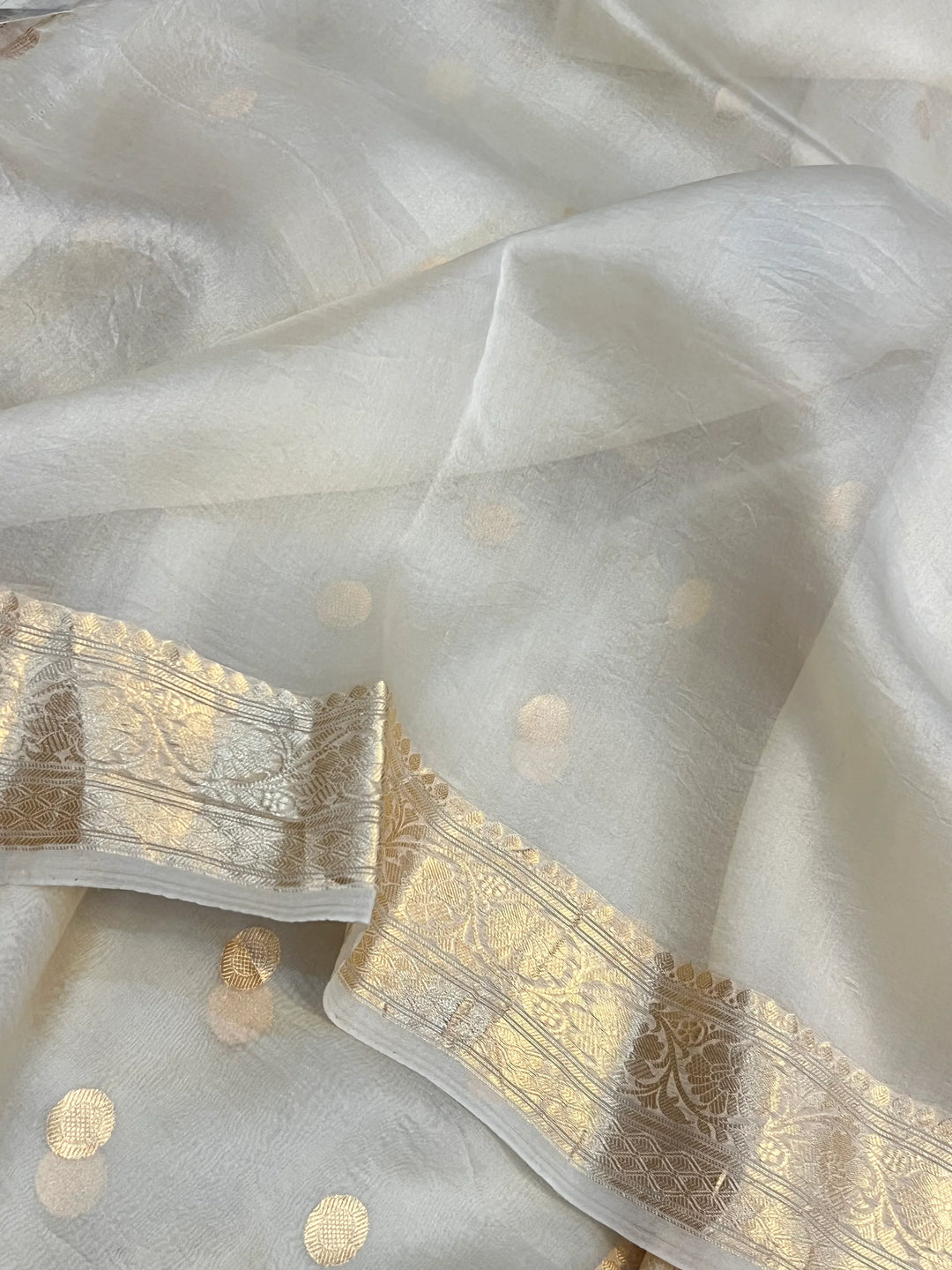 Cream Pure Banarasi handloom saree with intricate golden Kadhwa motifs 