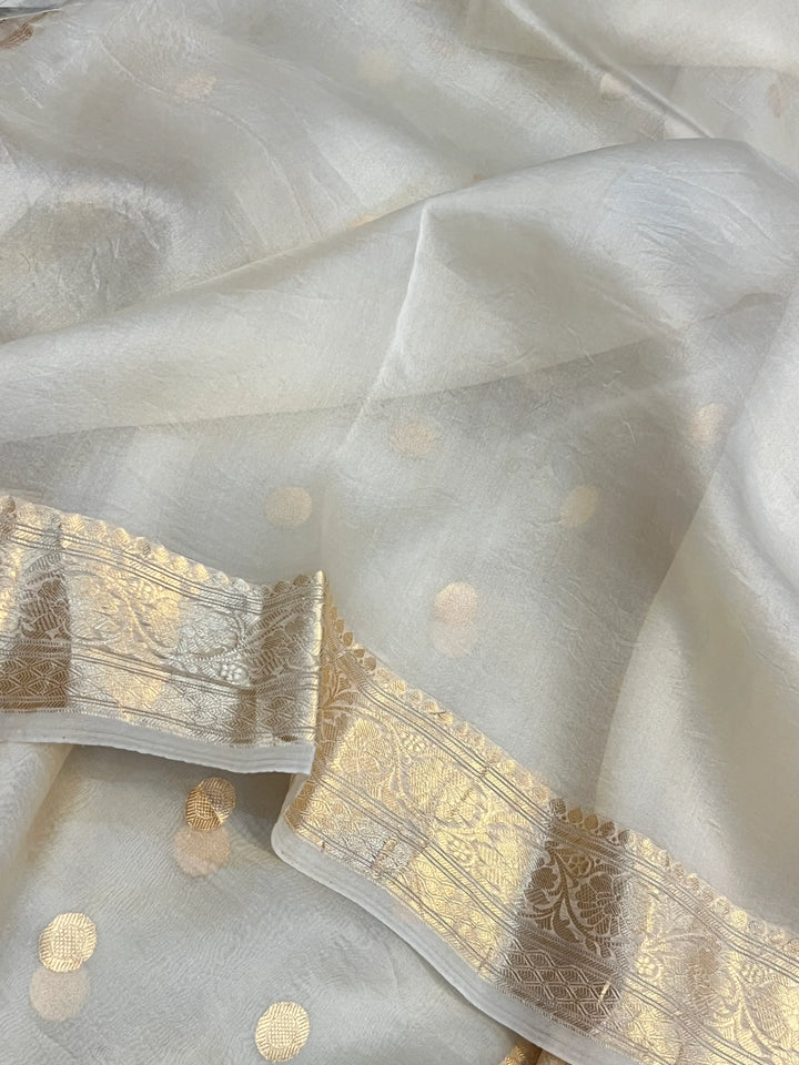 Cream Pure Banarasi handloom saree with intricate golden Kadhwa motifs 
