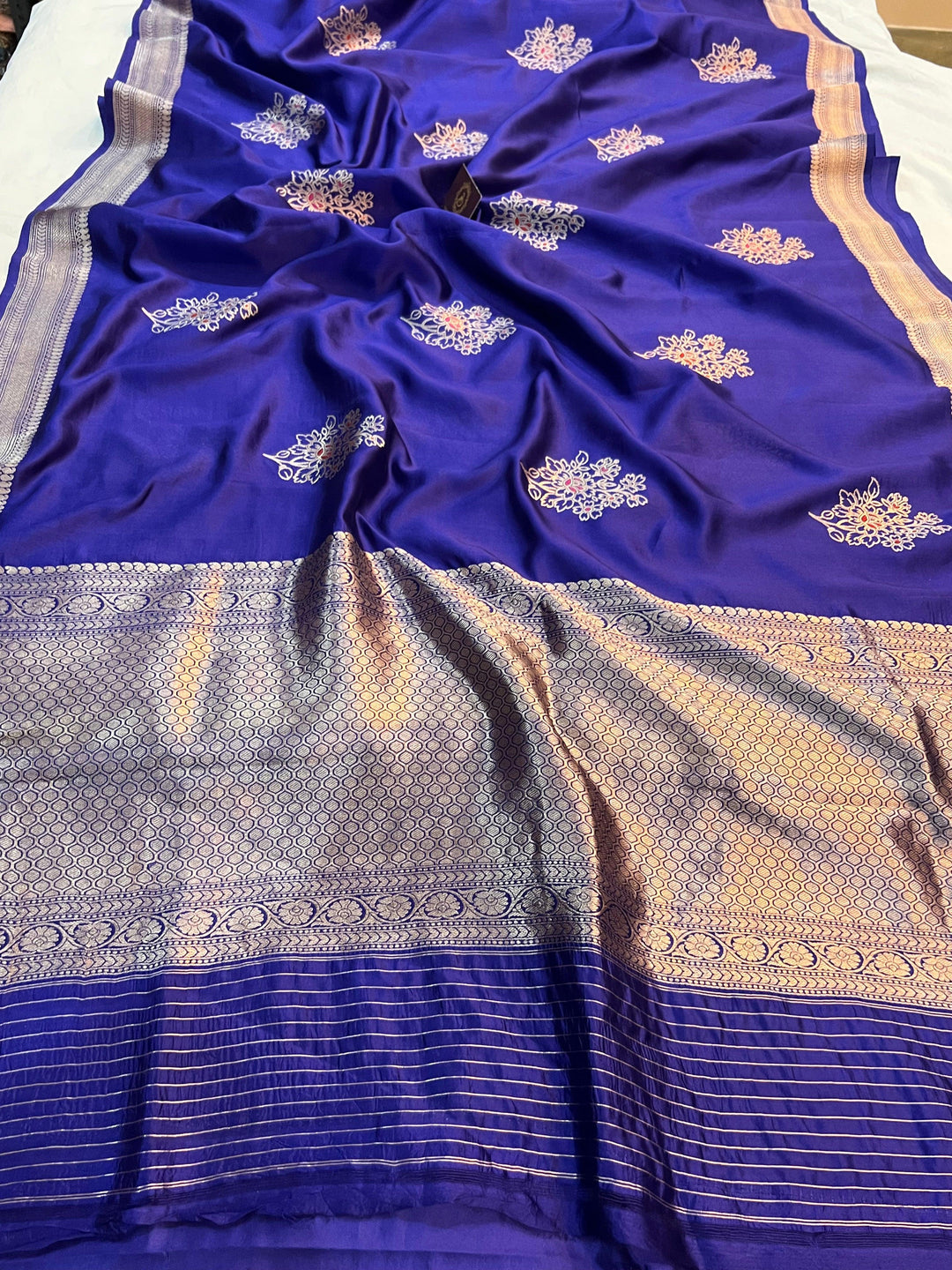 Rich pallu woven in golden zari on pure silk Banarasi saree with Meenakari butas