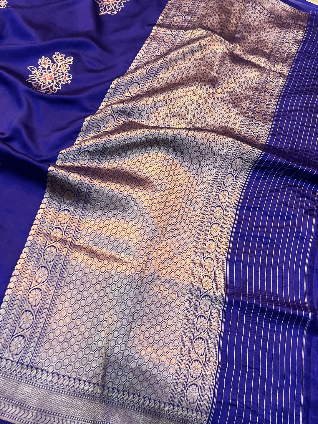 Rich pallu woven in golden zari on pure silk Banarasi saree with Meenakari butas