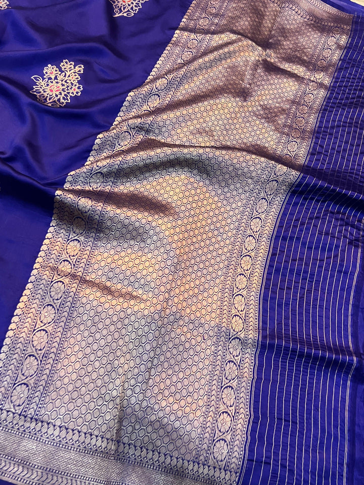 Rich pallu woven in golden zari on pure silk Banarasi saree with Meenakari butas