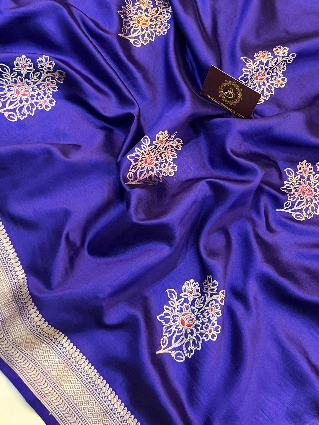 Intricate Kadhwa Meenakari butas in vibrant hues on pure silk Banarasi saree