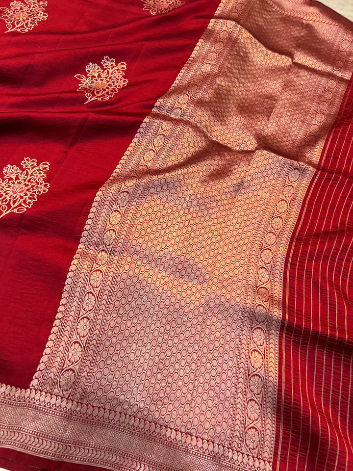 Rich pallu woven in golden zari on pure silk Banarasi saree with Meenakari butas