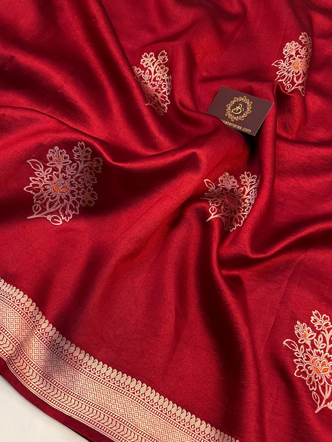 Intricate Kadhwa Meenakari butas in vibrant hues on pure silk Banarasi saree