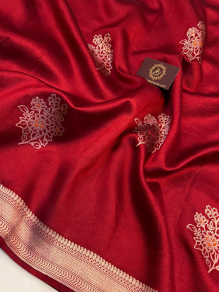 Intricate Kadhwa Meenakari butas in vibrant hues on pure silk Banarasi saree