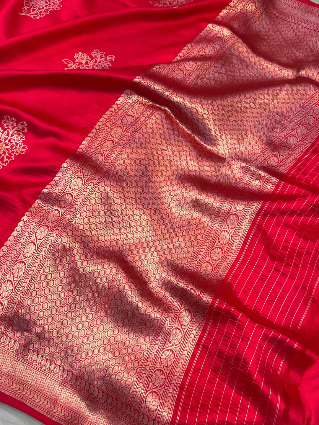 Rich pallu woven in golden zari on pure silk Banarasi saree with Meenakari butas