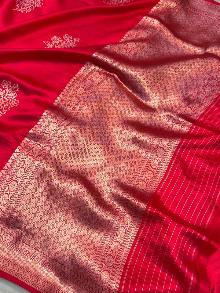 Rich pallu woven in golden zari on pure silk Banarasi saree with Meenakari butas