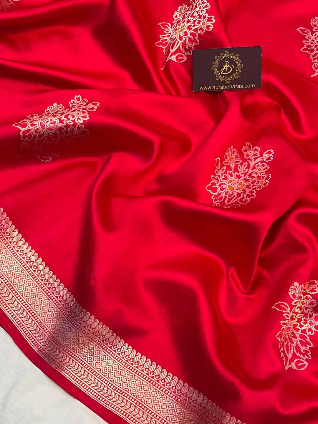 Intricate Kadhwa Meenakari butas in vibrant hues on pure silk Banarasi saree
