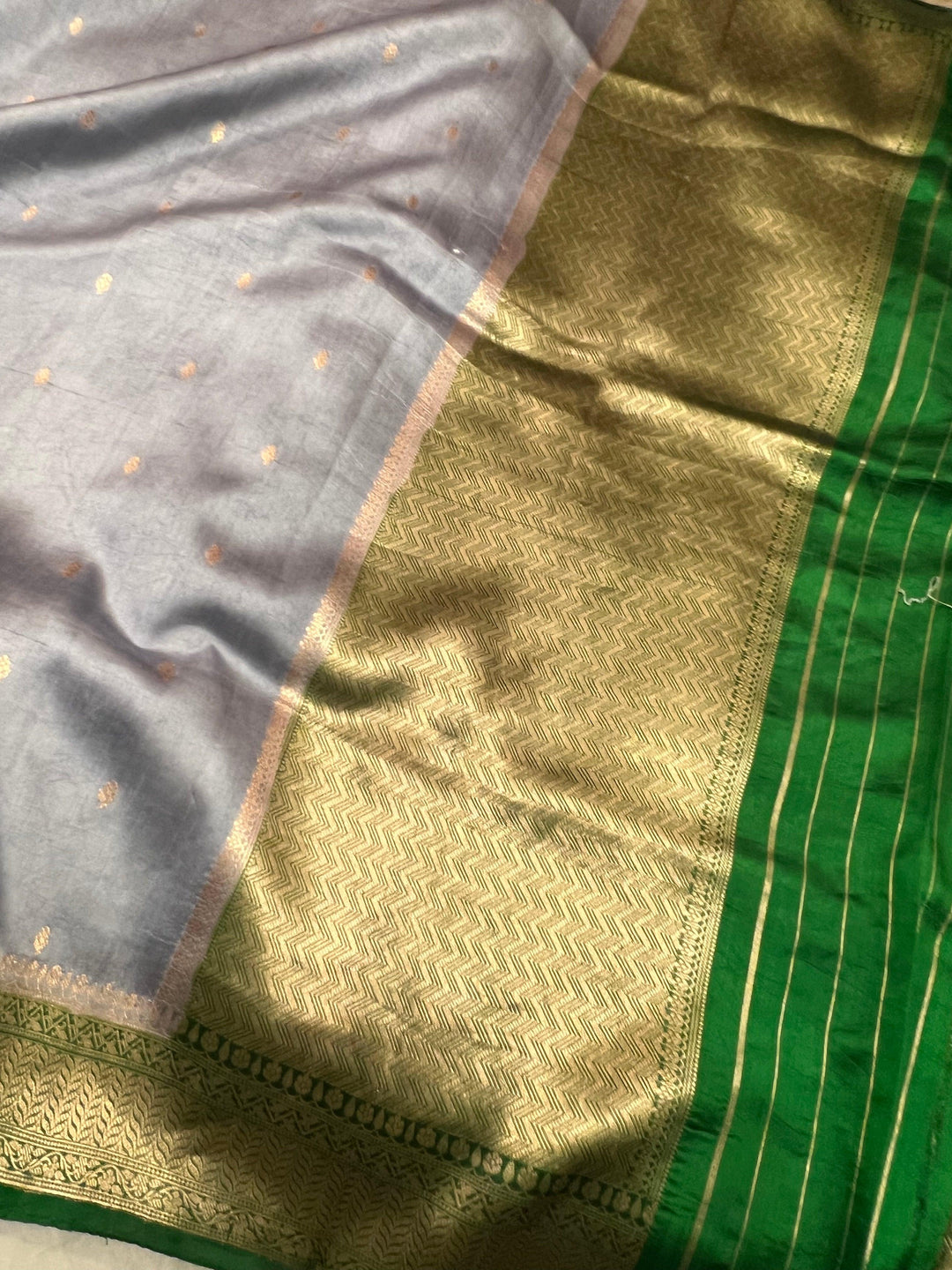Elegant pallu with subtle golden zari work and contrast Kadhwa border in a pure handloom Banarasi silk saree