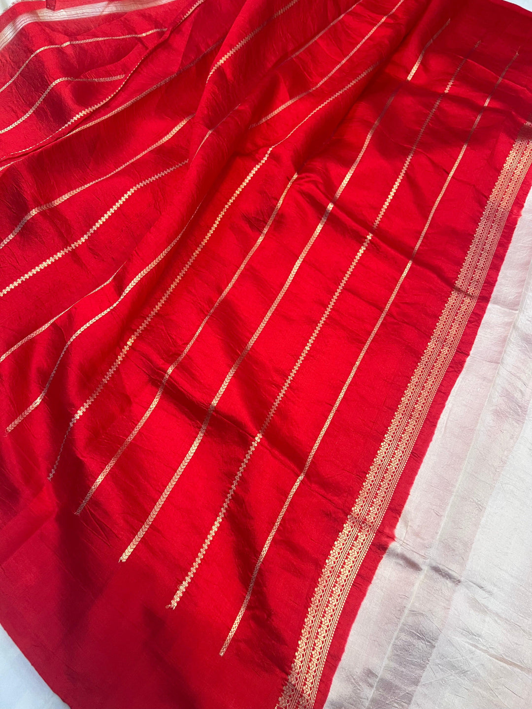 Stripe unstitched blouse piece included with the pure silk handloom Banarasi saree