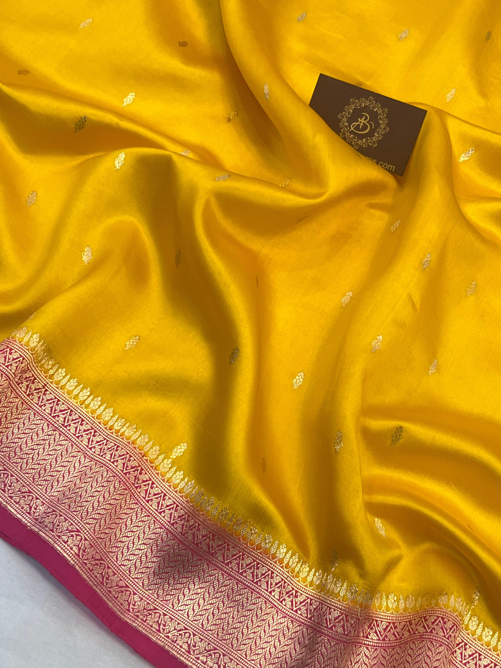 Detailed view of Kadhwa butis on lustrous pure silk Banarasi saree, handwoven in Varanasi