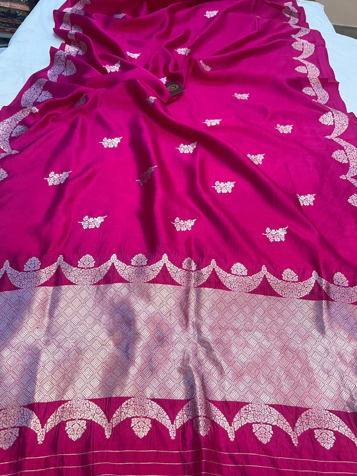 Rani Pink Pure silk handloom Banarasi saree with silver Kadhwa butas and scallop border