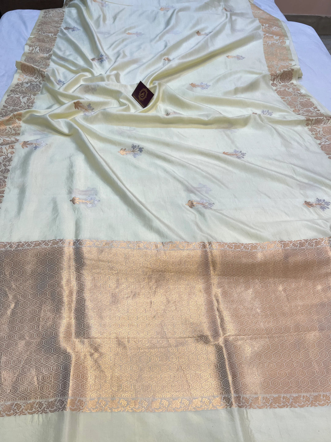 Cream Pure silk handloom Banarasi saree with golden Kadhwa floral motifs
