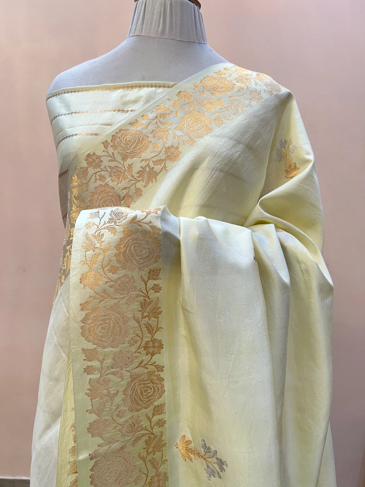 Cream Pure silk handloom Banarasi saree with golden Kadhwa floral motifs