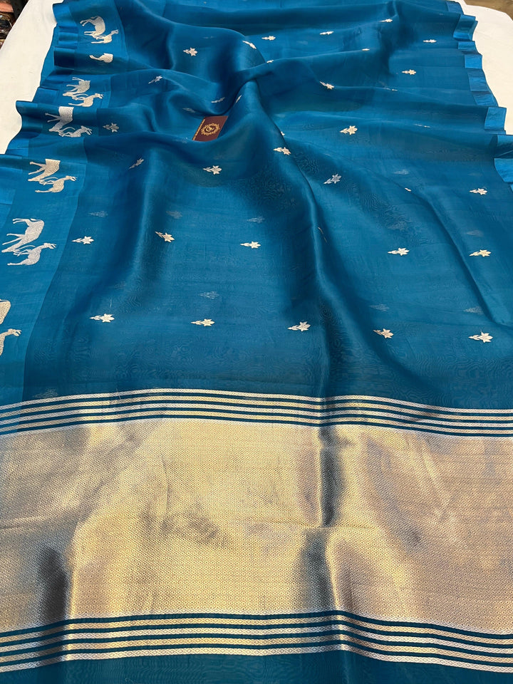 Pure Kora silk handloom Banarasi saree draped with Kadhwa Sona Rupa butis, Mashru silk border featuring hiran motifs, and elegant designer pallu
