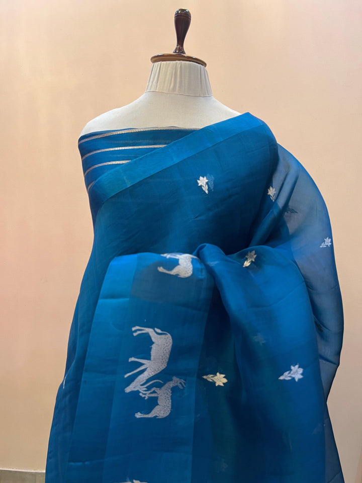 Pure Kora silk handloom Banarasi saree draped with Kadhwa Sona Rupa butis, Mashru silk border featuring hiran motifs, and elegant designer pallu