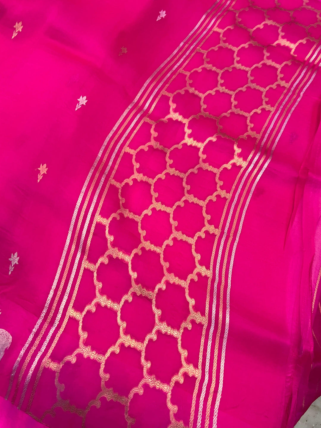 Classy designer pallu woven with shimmering golden zari on pure handloom Kora silk Banarasi saree