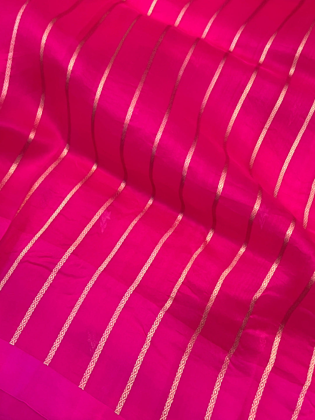 Blouse piece featuring elegant golden zari lines included with pure Kora silk Banarasi saree