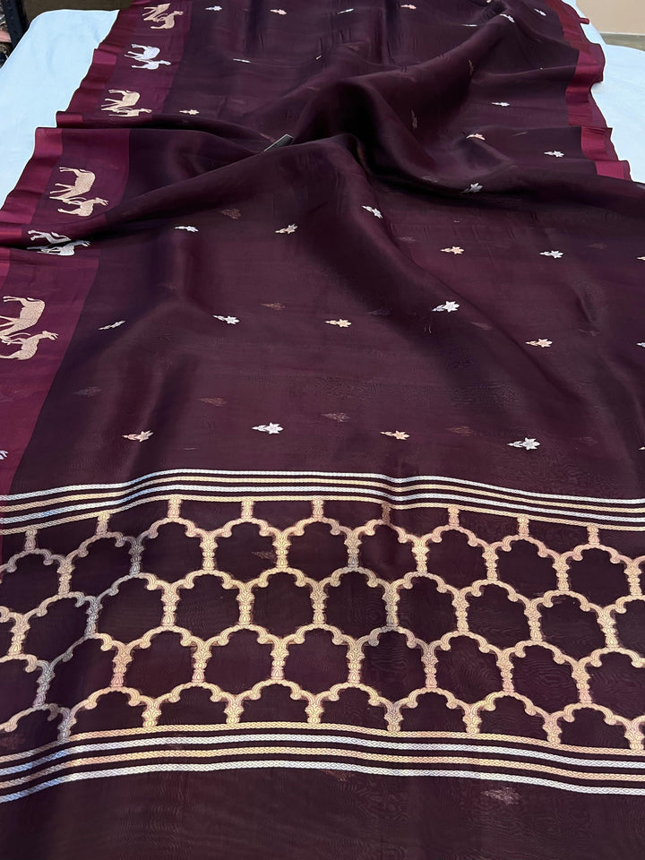 Pure Kora silk handloom Banarasi saree draped with Kadhwa Sona Rupa butis, Mashru silk border featuring hiran motifs, and elegant designer pallu