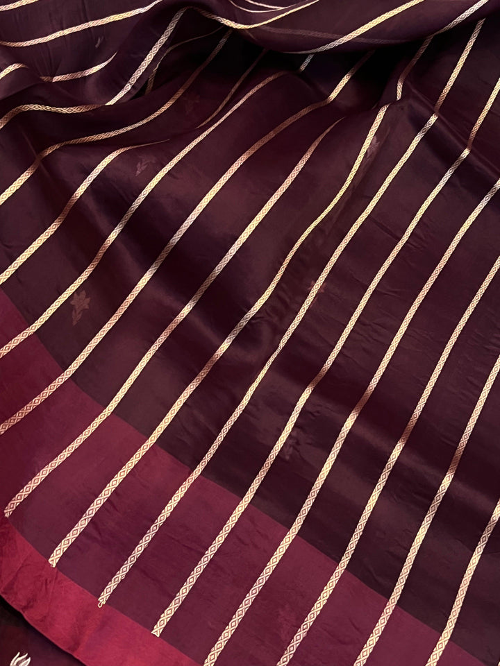 Blouse piece featuring elegant golden zari lines included with pure Kora silk Banarasi saree