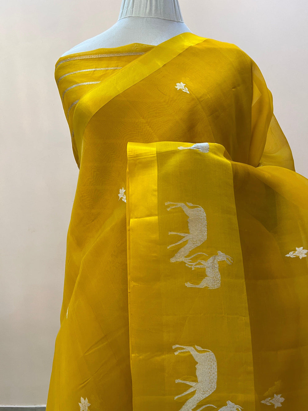 Pure Kora silk handloom Banarasi saree draped with Kadhwa Sona Rupa butis, Mashru silk border featuring hiran motifs, and elegant designer pallu