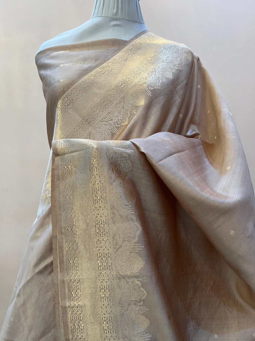 Draped pic of Beige Pure Chiniya Silk Handloom Banarasi Saree with golden zari kadhwa butis