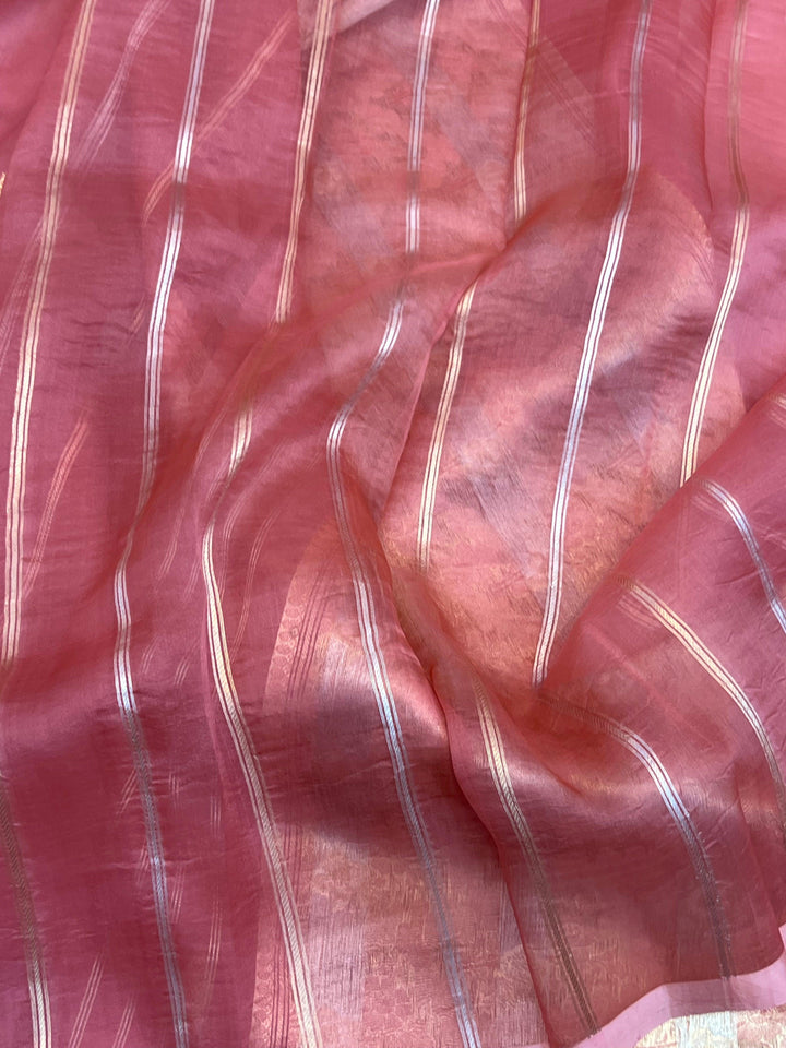 Blouse piece with golden zari lines included with the pure Kora silk Banarasi saree