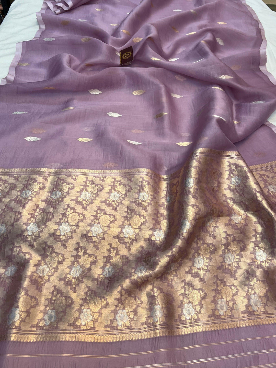 Pure Kora silk handloom Banarasi saree draped with Kadhwa Sona Rupa butis, sleek Mashru silk border, and elegant designer pallu