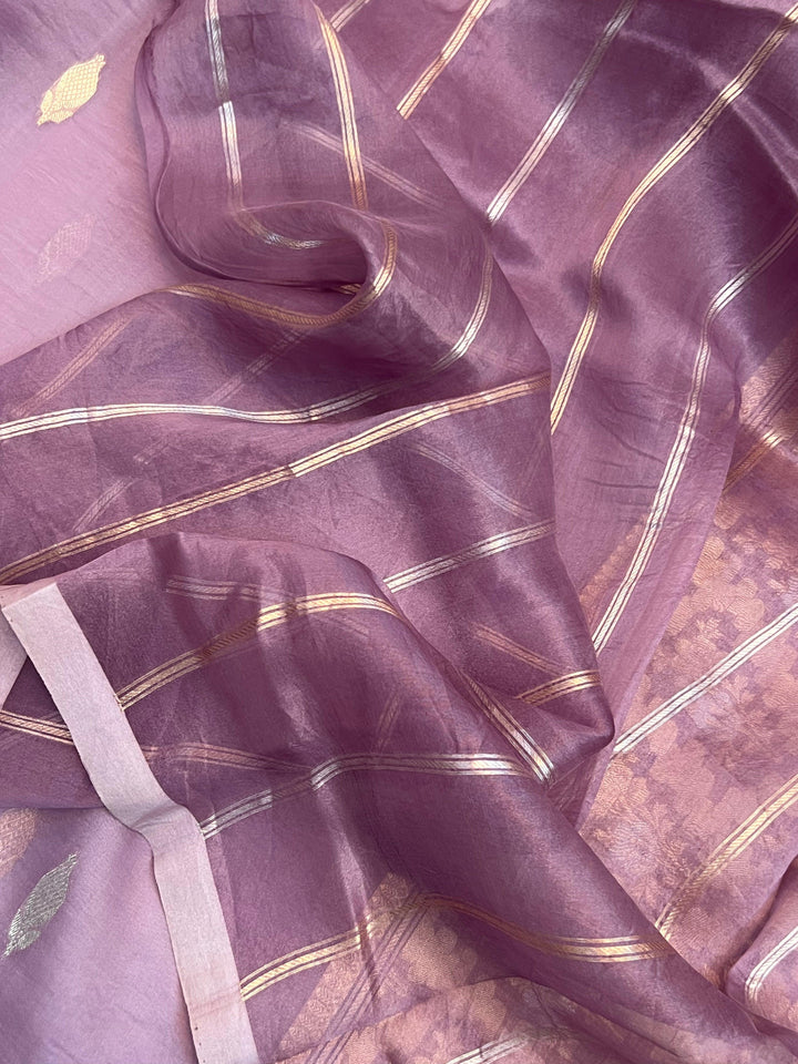 Blouse piece with golden zari lines included with the pure Kora silk Banarasi saree