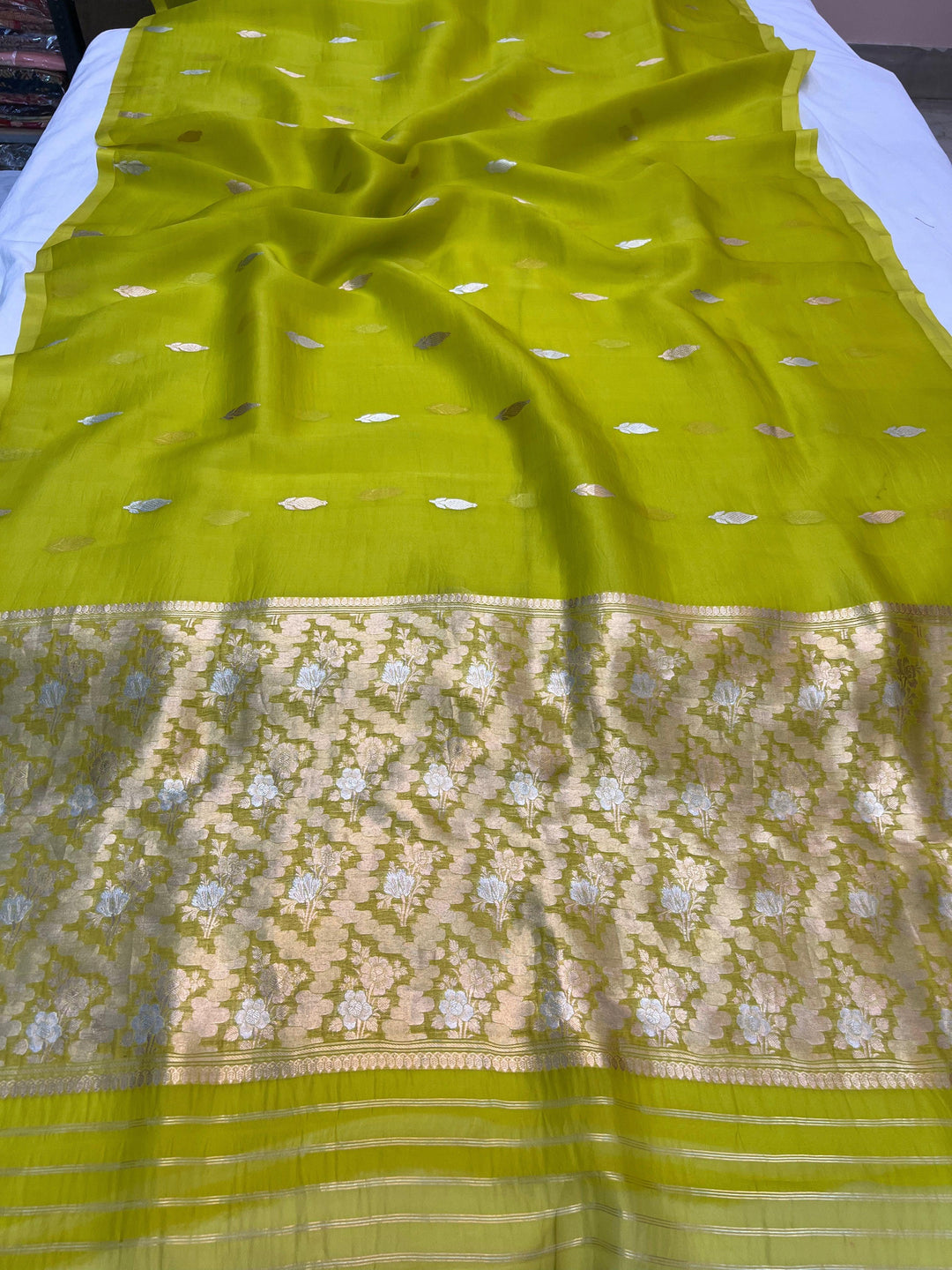 Pure Kora silk handloom Banarasi saree draped with Kadhwa Sona Rupa butis, sleek Mashru silk border, and elegant designer pallu