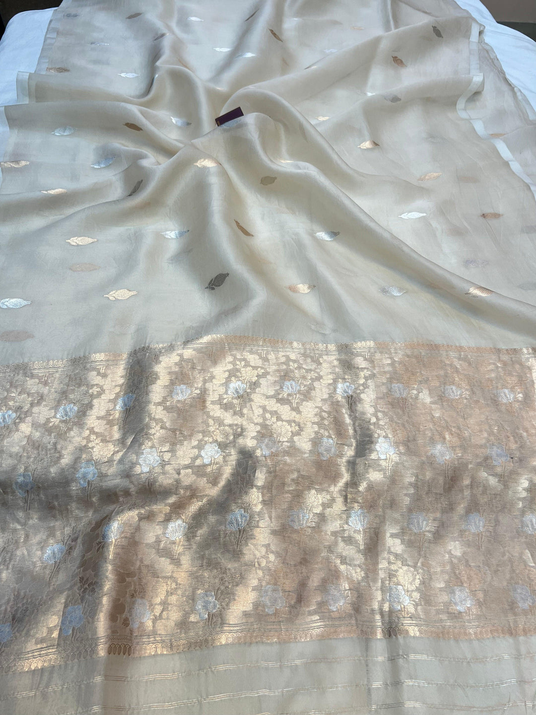 Pure Kora silk handloom Banarasi saree draped with Kadhwa Sona Rupa butis, sleek Mashru silk border, and elegant designer pallu