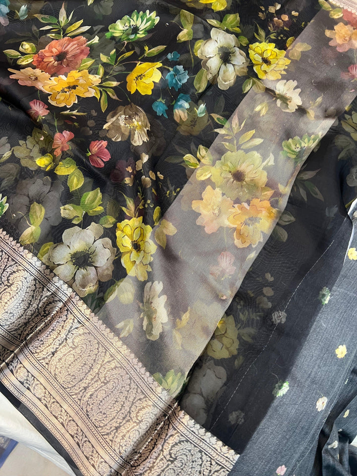 Graceful pallu of Kora silk saree featuring floral print and silver zari detailing