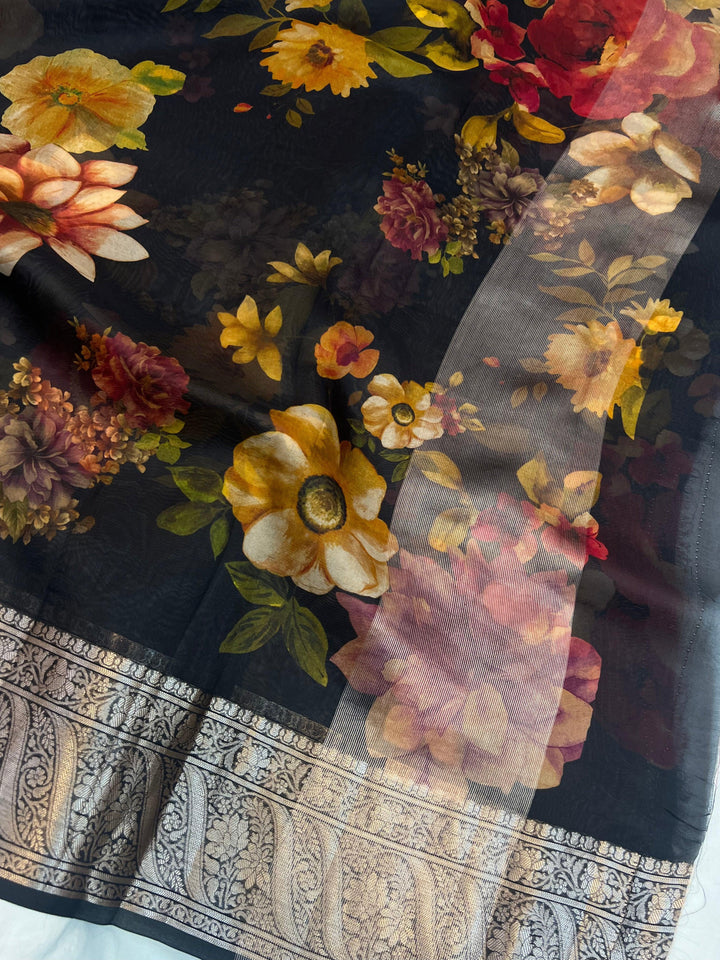 Graceful pallu of Kora silk saree featuring floral print and silver zari detailing