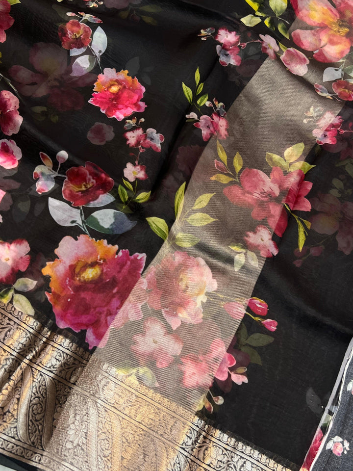 Graceful pallu of Kora silk saree featuring floral print and silver zari detailing