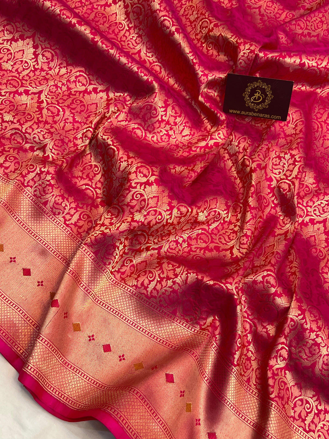 Golden zari geometric brocade work on pure Katan silk Banarasi saree with Meenakari border
