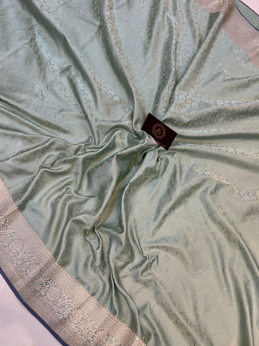 Kadhwa Banarasi border in golden zari on pure satin silk saree