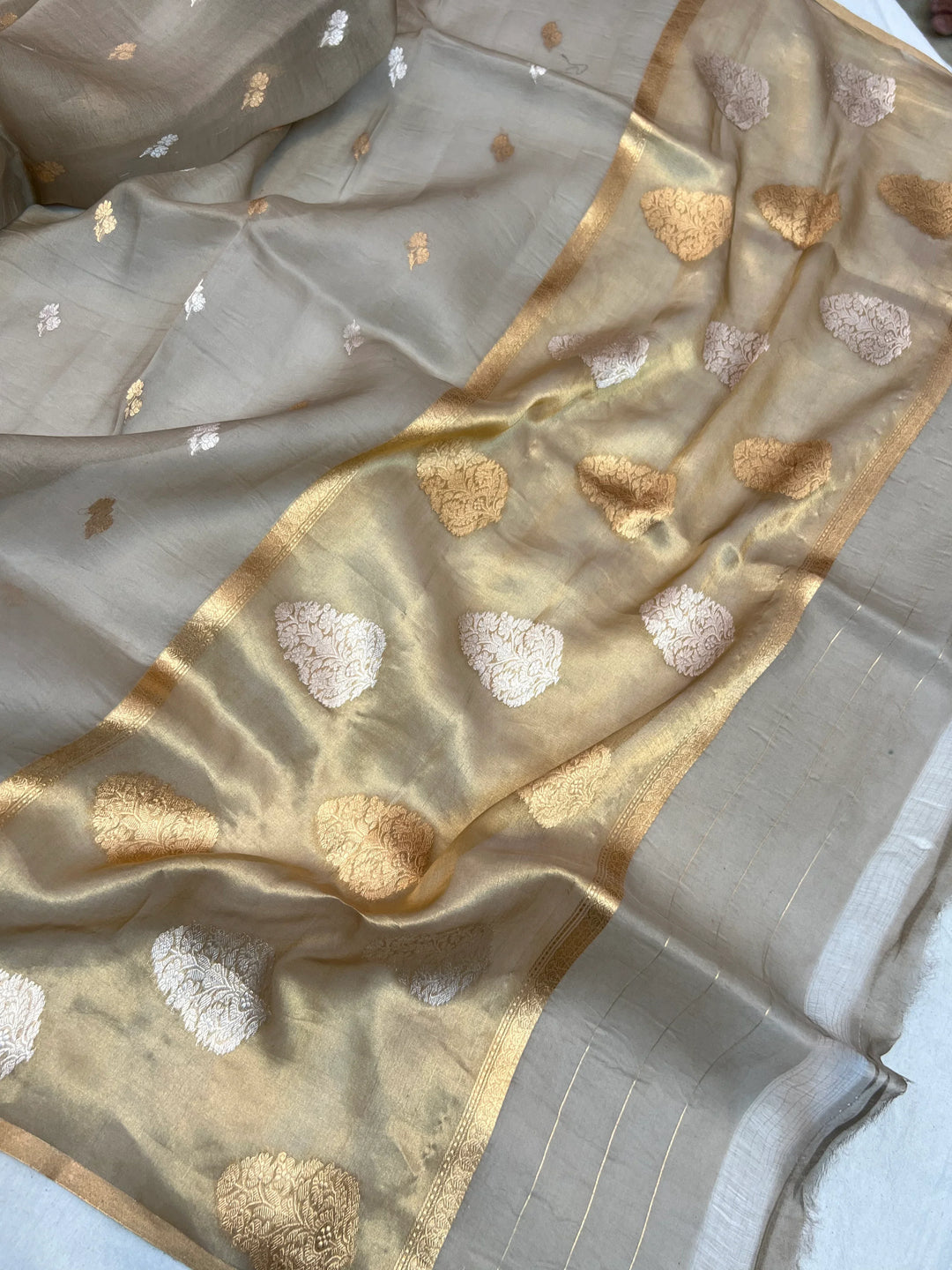 Pallu of Banarasi saree in shimmering tissue silk with golden zari work