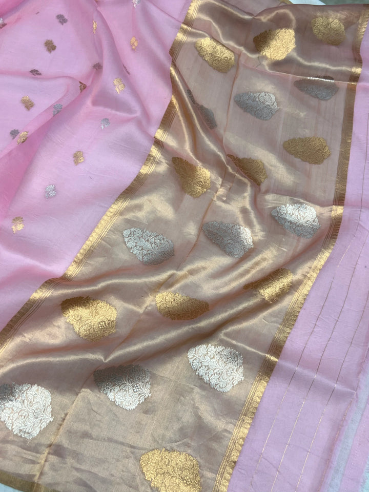 Pallu of Banarasi saree in shimmering tissue silk with golden zari work