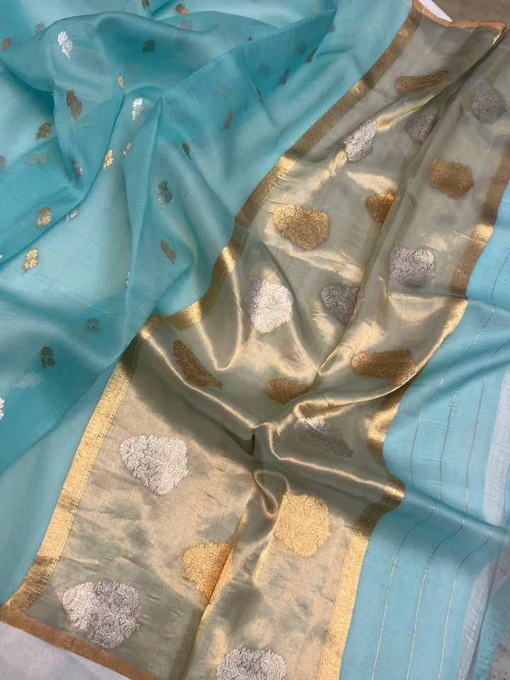 Pallu of Banarasi saree in shimmering tissue silk with golden zari work