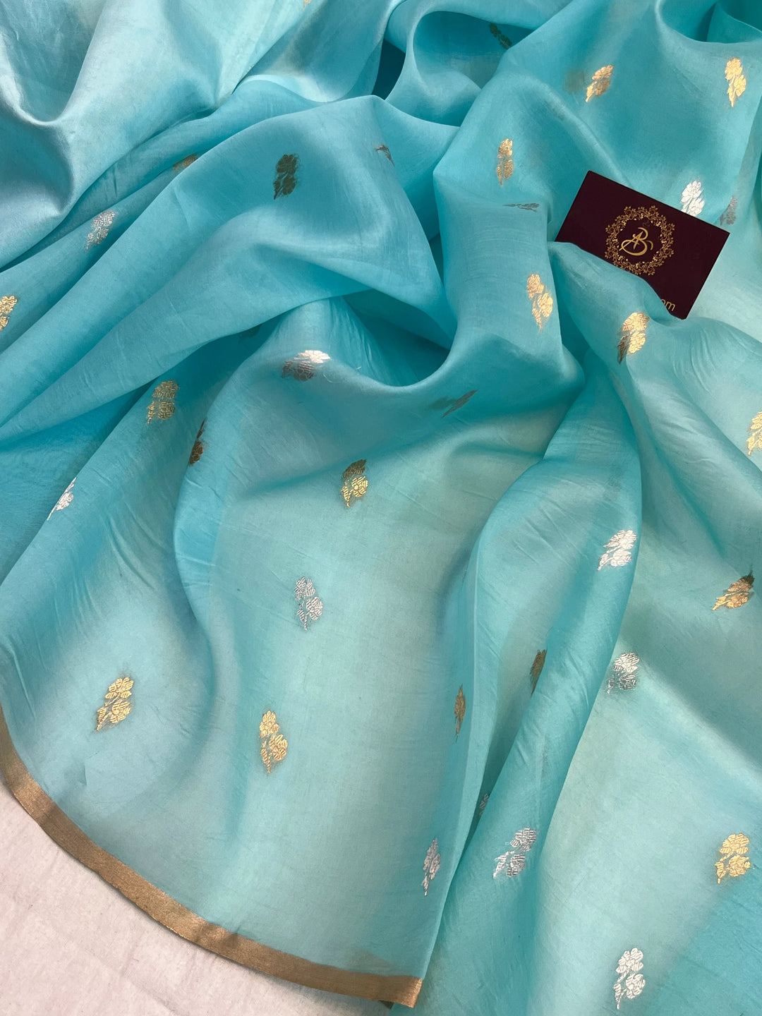 Close-up of Kadhwa sona rupa butis on triple weave Banarasi saree