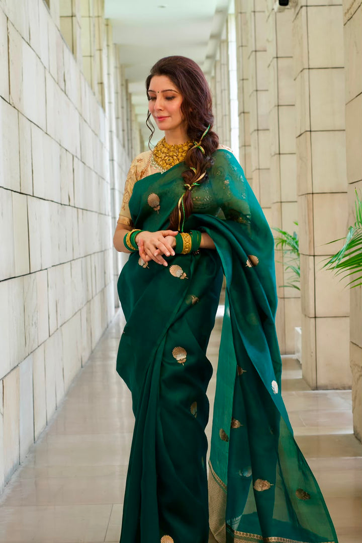 Dr Jai Madaan in a Bottle Green Kora Silk Banarasi Saree with Sona Rupa Butis