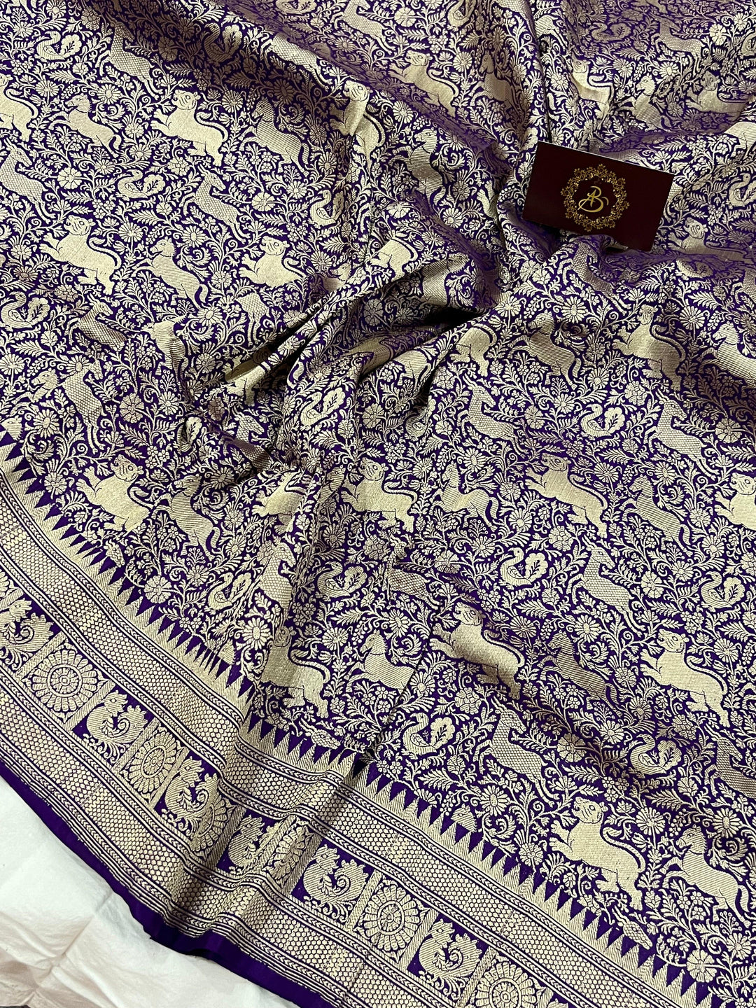 Cutwork weave detail on Katan silk fabric with traditional Shikargaah pattern