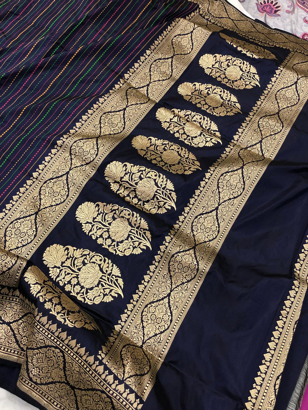Detailed pallu of Banarasi handloom saree showcasing Kadhwa zari weaving on pure Katan silk